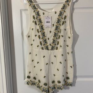 Adorable Free People ivory embroidered romper